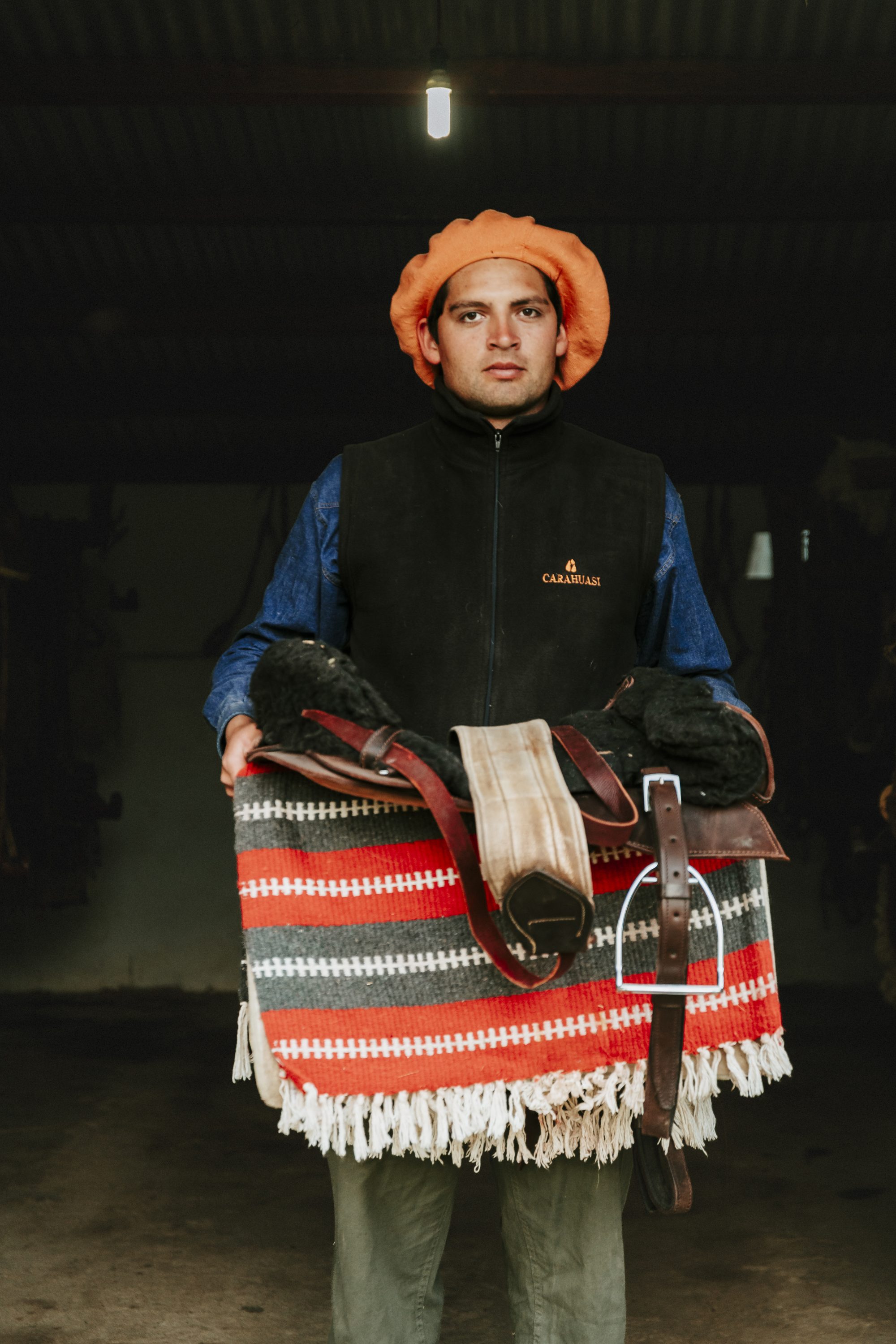 Lucas, ride guide, holding a striped blanket