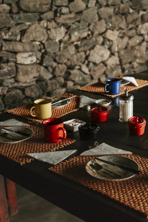 Breakfast table against the dry-stone wall