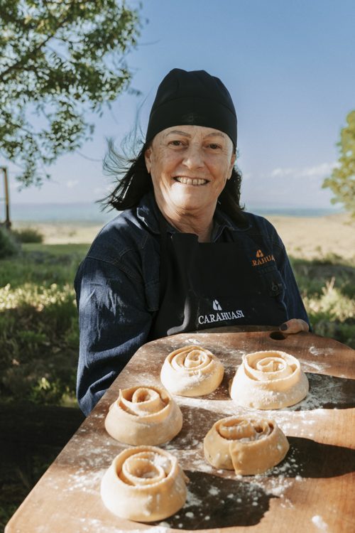 Luciana with a tray of freshly made rolls